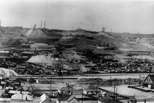 buttehill-1890 The Butte Hill in the 1890's. Notice the thick smog in the sky, produced by the numerous small smelters in the city at the time. Also note the expansive piles of acidic waste rock.